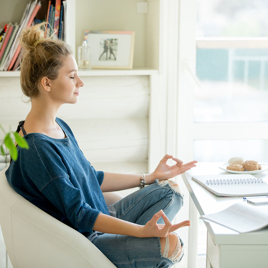 woman meditating at desk