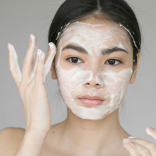 woman washing face 